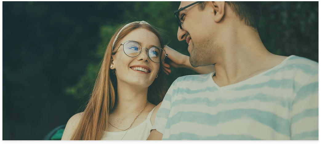 Smiling couple wearing glasses
