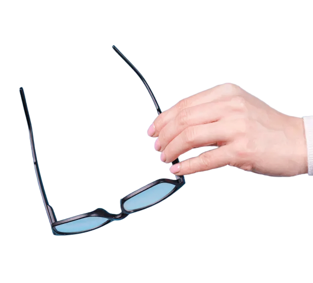 Hand holding a pair of glasses
